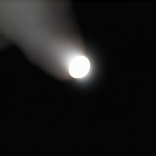 Person inspecting a computer monitor with a flashlight in a dark room to find dead pixels
